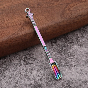 Close-up of rainbow metal mini scoop tool with embossed handle and hanging ring detail