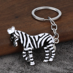 Cute zebra keychain charm featuring black and white enamel stripes and silver metal ring