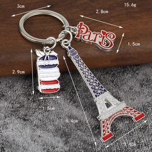 Zinc alloy Eiffel Tower keychain with Paris tag and colorful macarons detail view