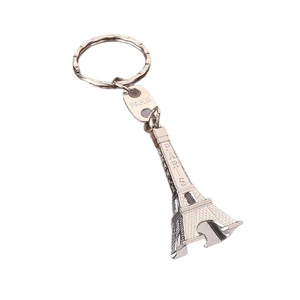 Polished silver metal Eiffel Tower keychain with Paris engraving on a white background