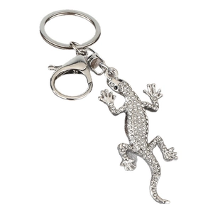 Porte-clés gecko en alliage argenté orné de strass blancs avec un fermoir mousqueton