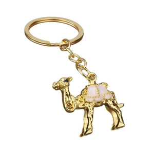 Golden camel keychain with pink enamel details and polished metallic mirror finish