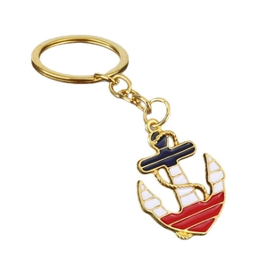 Golden nautical anchor keychain with colorful navy blue enamel and metallic rope details