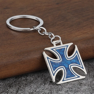 Retro hip-hop silver cross keychain featuring vibrant blue glitter inlays on metal