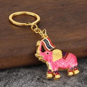 Golden Thai elephant keychain with pink marble enamel finish and Thailand flag detail