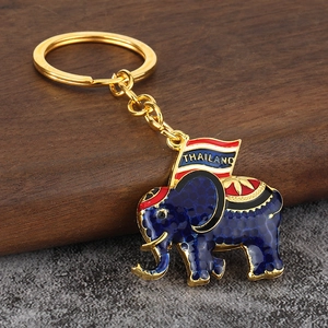 Macro detail of dark blue enamel elephant keychain with Thailand flag and golden ring