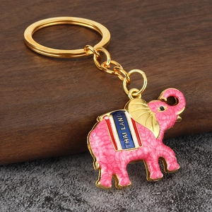 Pink enamel Thai elephant keychain with gold metal chain and Thailand striped detail