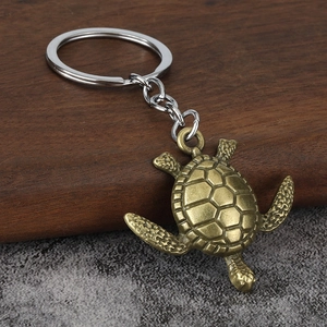 Vintage bronze turtle keychain with detailed shell pattern and sturdy silver key ring