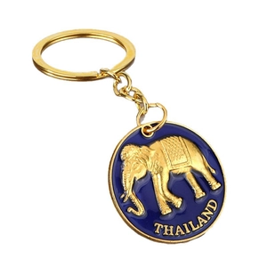 Golden Thai elephant keychain with blue enamel pendant and Thailand engraving