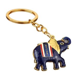 Golden Thai elephant keychain with blue enamel texture and Thailand inscription on saddle