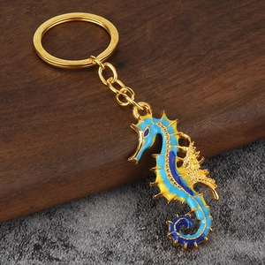 Creative seahorse keychain with blue and yellow enamel details on gold-tone alloy metal