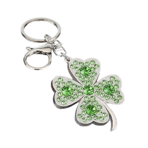 Green rhinestone four-leaf clover keychain with silver metal lobster clasp on white background