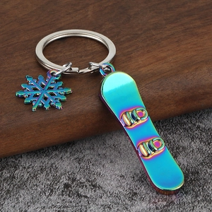 Rainbow plated snowboard and snowflake keychain set for winter sports lovers