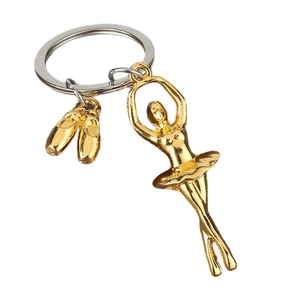 Golden ballet dancer keychain featuring delicate alloy pointe shoes and ballerina pendants