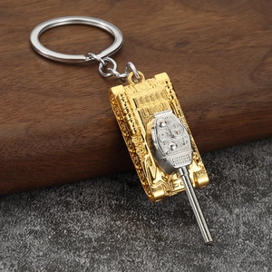 Detailed macro view of a T34 tank keychain model with silver and gold metal finishes