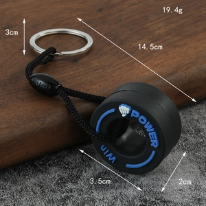 Creative PVC mini tire keychain with blue power text and black braided strap for cars