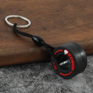 Creative PVC tire keychain featuring black rubber loop with red Win Power text and metal ring