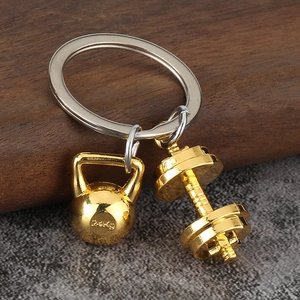 Fitness themed metal keychain with gold-tone kettlebell and dumbbell on a silver ring