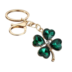 Green crystal four-leaf clover keychain with gold metal frame and sparkling rhinestone