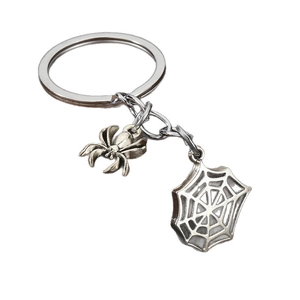 Vintage silver spider and spiderweb keychain pendant with a metallic matte finish