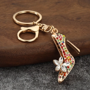 Detail of crystal high heel keychain with colorful rhinestones and gold-plated finish