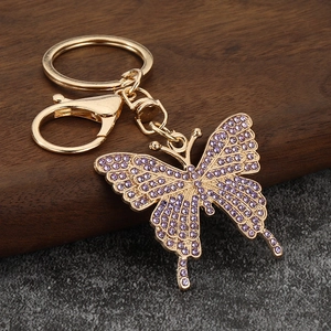 Detailed close-up of butterfly keychain with purple rhinestones and gold alloy lobster clasp