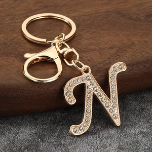 Detail of gold letter N keychain with sparkling rhinestones and lobster clasp