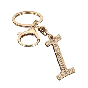 Golden letter L keychain with sparkling white rhinestones and lobster clasp on white background