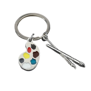 Porte-clés palette d'artiste en métal avec touches de peinture colorées sur fond blanc pur