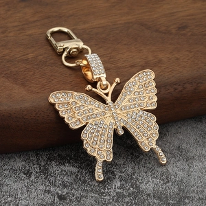 Sparkling crystal butterfly keychain in gold alloy finish with full rhinestone inlay