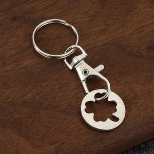 Silver zinc alloy keychain with four-leaf clover pendant and trolley coin function