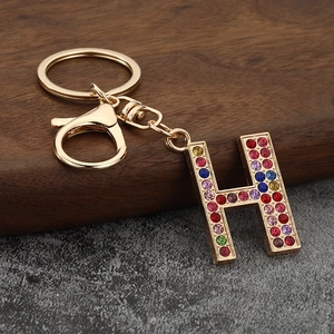 Detail of letter H keychain featuring colorful rhinestones and gold lobster clasp