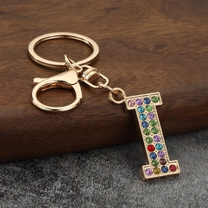 Detail of letter I keychain with colorful rhinestones and golden lobster clasp for bags