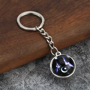 Luminous constellation glass pendant keychain featuring a celestial galaxy star design