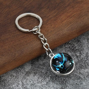 Luminous constellation glass cabochon keychain with celestial blue pattern and silver ring