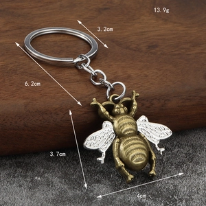 Vintage bronze and silver bee keychain with detailed wings weighing 13.9g for accessories