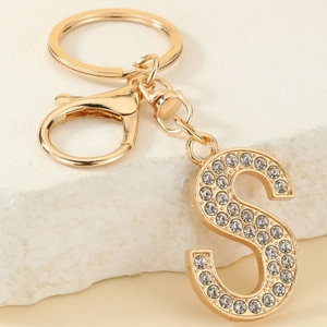 Detail of gold letter S keychain with sparkling rhinestones and lobster clasp