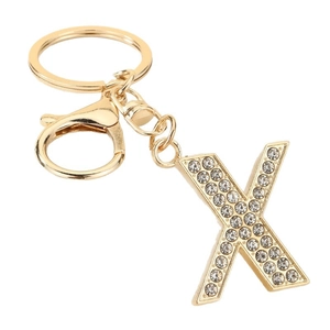 Golden alphabet X keychain with sparkling rhinestones on a white background
