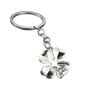 Antique silver four-leaf clover keychain with Good Luck engraving on metal pendant