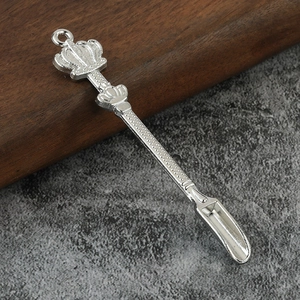 Detailed close-up of a silver crown metal mini scoop with textured anti-slip handle