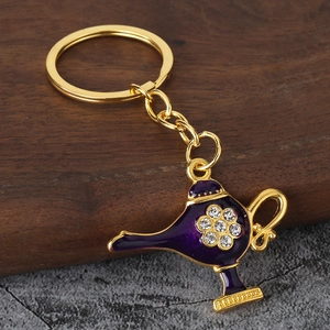 Exquisite gold Aladdin lamp keychain with purple enamel and sparkling flower rhinestone