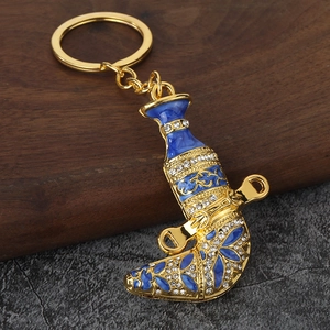 Exquisite gold-plated Oman Khanjar keychain with blue enamel and rhinestones