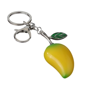 Realistic mango resin keychain with green leaf, silver ring and lobster clasp on white background
