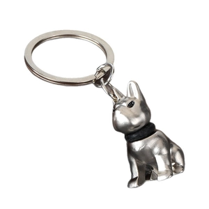 Detailed 3D silver metal bulldog keychain with black collar on a minimalist ring