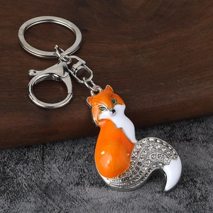 Detailed view of orange enamel fox keychain with sparkling rhinestones and lobster clasp