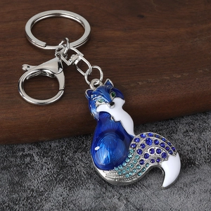 Detail of fox keychain with royal blue enamel finish and sparkling blue rhinestones