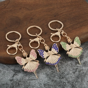 Fashionable angel girl keychains with sparkling rhinestones in pink, blue and green colors