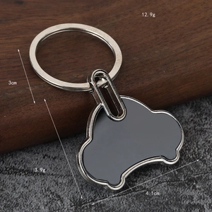 Detailed view of car-shaped metal bottle opener keychain with dimensions and weight