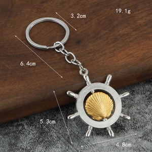 Marine nautical spinning ship wheel keychain with gold shell and measurement details