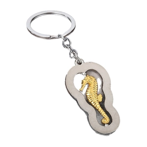 Creative rotating seahorse keychain made of premium gold and silver metal with a swivel design